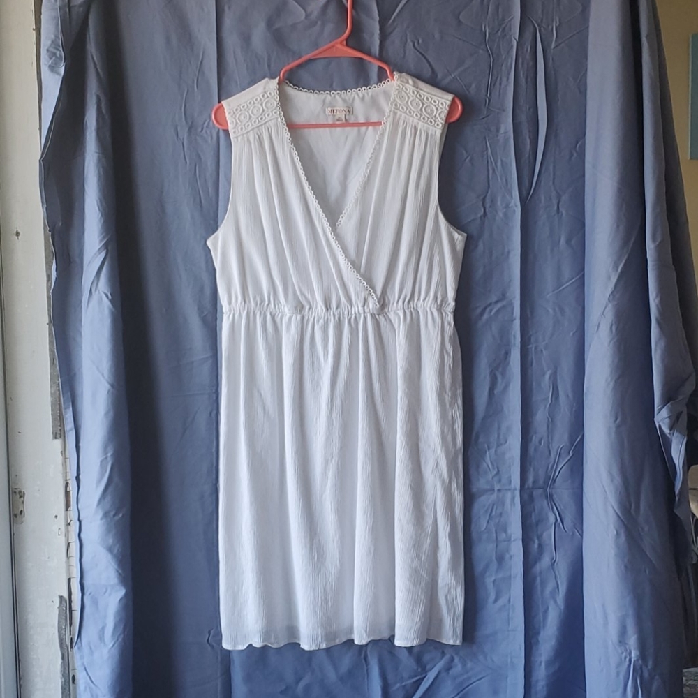 White sleeveless mid length dress